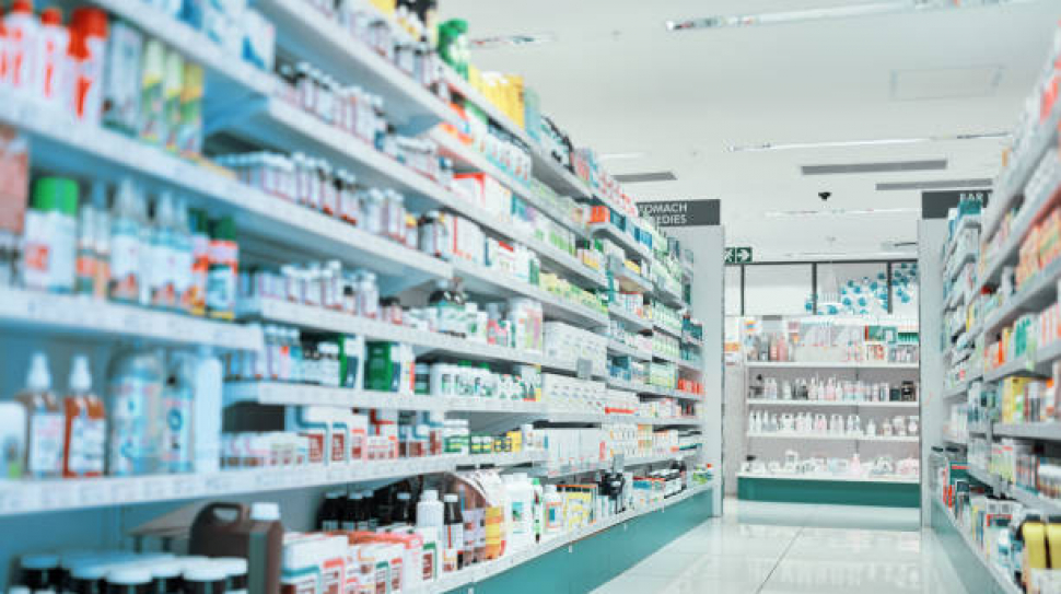 Cropped shot of fully stocked shelves in an aisle of a pharmacy