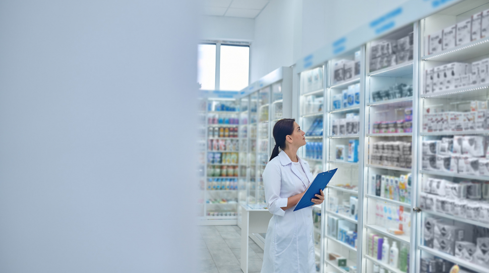 pharmacist-checking-medicines-drugstore